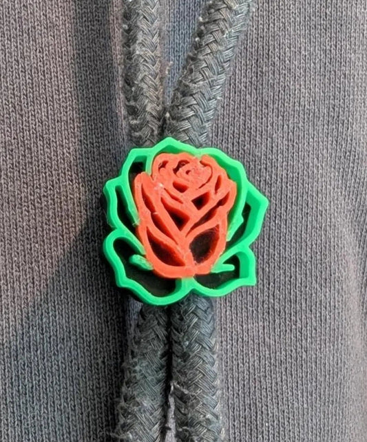 3D-printed rose-shaped object on a gray background