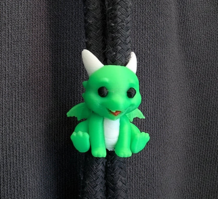Green dragon zipper pull on a gray hoodie